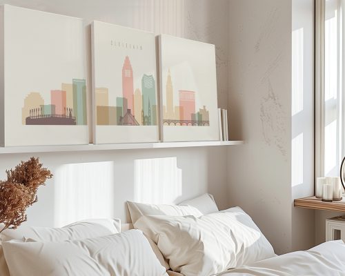 Three canvas prints depicting a stylized cityscape of Cleveland with pastel colors.