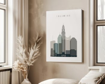 Stylized artwork of the Columbus city skyline with a neutral color palette displayed on a wall.