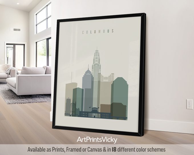 Framed artwork depicting a stylized cityscape of Columbus with various building silhouettes.