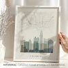 Framed map of Columbus featuring a skyline and street layout in a minimalist design.