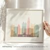 Art print featuring a stylized skyline of Columbus with various building silhouettes in pastel colors.