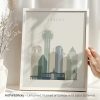 Framed print of the Dallas city skyline featuring various iconic buildings in muted colors.