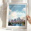 Framed art print of Denver cityscape featuring buildings and a river under a cloudy sky.