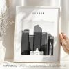 Framed artwork featuring a black and white cityscape of Denver with the word 'DENVER' at the top.