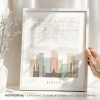 Framed map print of Denver featuring key buildings and a grid layout.
