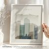 Framed art print featuring a stylized depiction of Denver's skyline with mountains in the background.