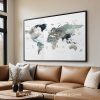 World map artwork featuring earth tones displayed in a modern living room setting.