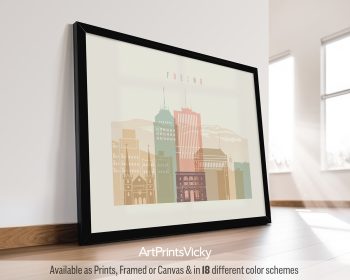 Framed artwork depicting a stylized cityscape of Fresno with various buildings in soft colors.