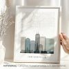 Framed map print of Indianapolis featuring key landmarks and a skyline illustration.