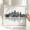 Framed artwork depicting the skyline of Kansas City in a minimalist style.