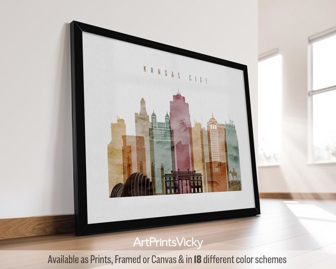 Framed artwork featuring a stylized cityscape of Kansas City with various buildings and colors.