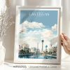 Framed artwork depicting a cityscape of Las Vegas with clouds and iconic buildings.