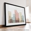 Framed print of a stylized cityscape of Leeds with various building silhouettes.