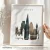 Framed artwork featuring a silhouette cityscape of London with notable landmarks.
