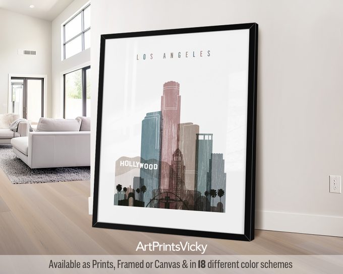 Framed artwork featuring a stylized cityscape of Los Angeles with the word 'Hollywood'.