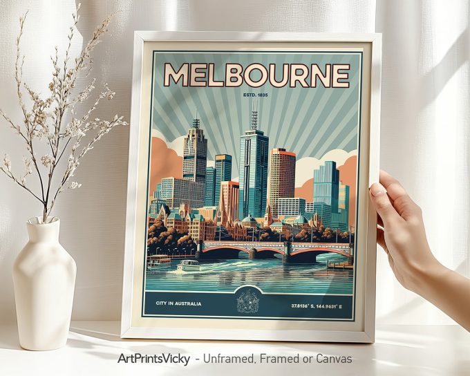 Framed artwork depicting the cityscape of Melbourne with stylized buildings and a river.