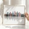 Framed artwork depicting a cityscape of Montreal with various buildings and structures.