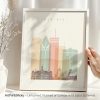 Art print of a stylized cityscape of Montreal featuring notable buildings in pastel colors.
