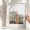 Art print of Montreal cityscape featuring various buildings and landmarks in a framed design.