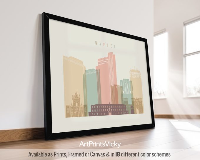 Framed artwork depicting the skyline of Naples with various buildings in pastel colors.