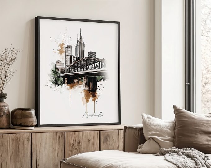 Framed artwork depicting a cityscape of Nashville with a bridge and skyline in black and white with color accents.