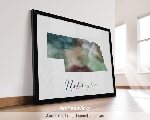 Earthy watercolor print of the Nebraska state map, with "Nebraska" written below in handwritten script, on a textured background. Perfect for lovers of the Cornhusker State and prairie landscapes by ArtPrintsVicky.