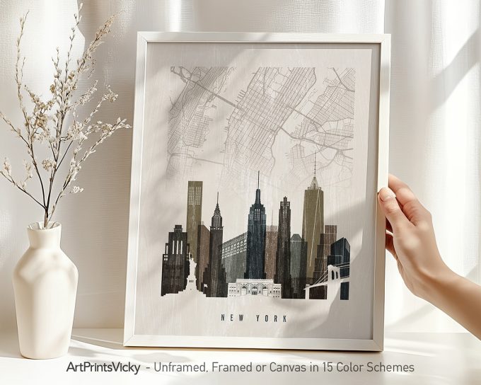 Framed print of a New York City skyline with a map background in neutral colors.