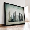 Framed artwork depicting the New York City skyline with notable buildings and the Statue of Liberty.
