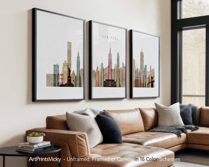 Three framed art prints depicting the New York City skyline with various buildings and structures.