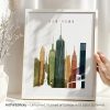Art print of the New York City skyline featuring iconic buildings and the Statue of Liberty.