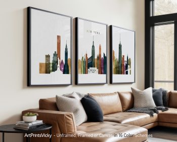 Three framed art prints of a New York City skyline featuring various buildings and structures.