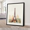 Framed artwork featuring a silhouette of the Eiffel Tower and other Paris landmarks in soft colors.