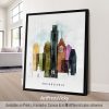 Framed artwork depicting a cityscape of Philadelphia with colorful buildings and the word 'Philadelphia'.