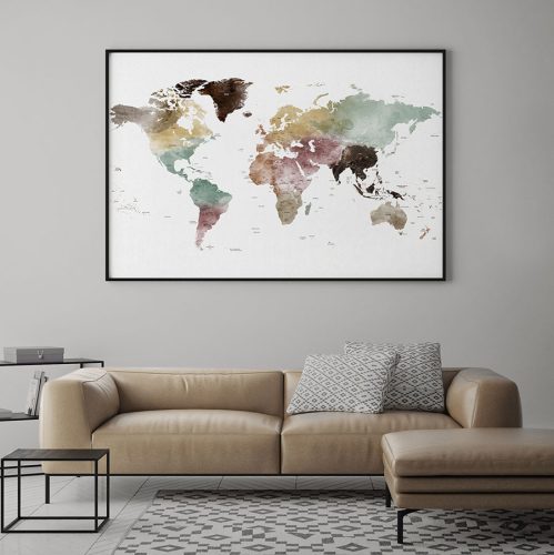 Artistic world map with muted colors displayed in a frame on a wall.