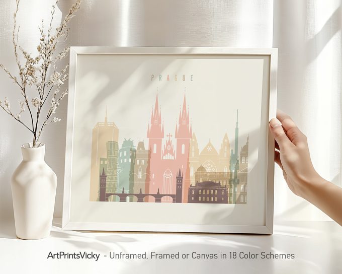 Art print of Prague's cityscape featuring iconic buildings in pastel colors within a frame.