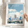 Illustrated cityscape print of Raleigh with buildings and clouds in a blue sky.