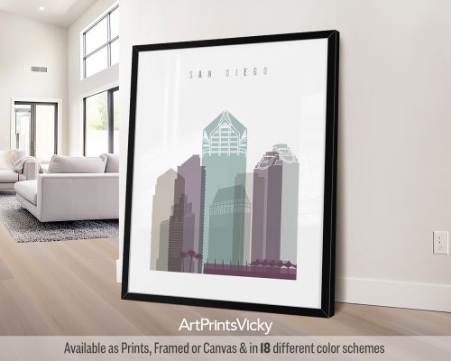 Framed artwork depicting a stylized cityscape of San Diego with tall buildings in muted colors.