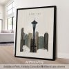 Framed artwork depicting a stylized cityscape of Seattle with the Space Needle.