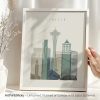 Art print of Seattle skyline featuring the Space Needle and other buildings in muted colors.