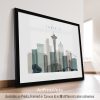 Framed artwork depicting a stylized cityscape of Seattle with notable buildings.