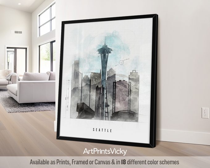 Framed artwork featuring a watercolor depiction of the Seattle skyline with the Space Needle.