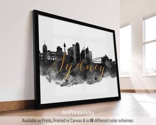 Black and white watercolor art print featuring a breathtaking vista of the Sydney cityscape with the iconic Sydney Opera House and Harbour Bridge. The city's name is written in a bold faux gold foil font in the middle of the print. by ArtPrintsVicky.