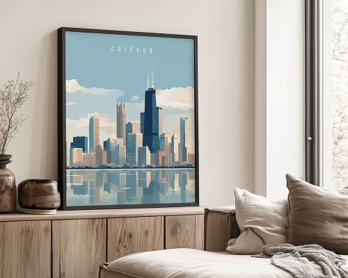 Framed artwork of the Chicago skyline with a blue sky and reflections in water.