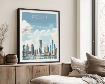 Framed artwork featuring a stylized cityscape of Detroit with clouds and a bridge.