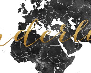 Black and white world map featuring gold script text overlaying the continents.
